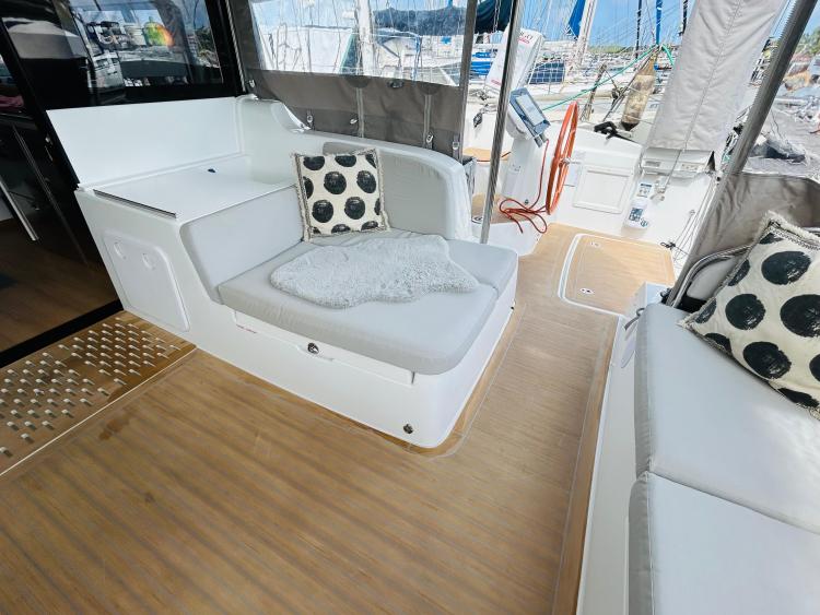 Luxurious 2024 Excess 14 yacht interior with comfortable seating and stylish decor.
