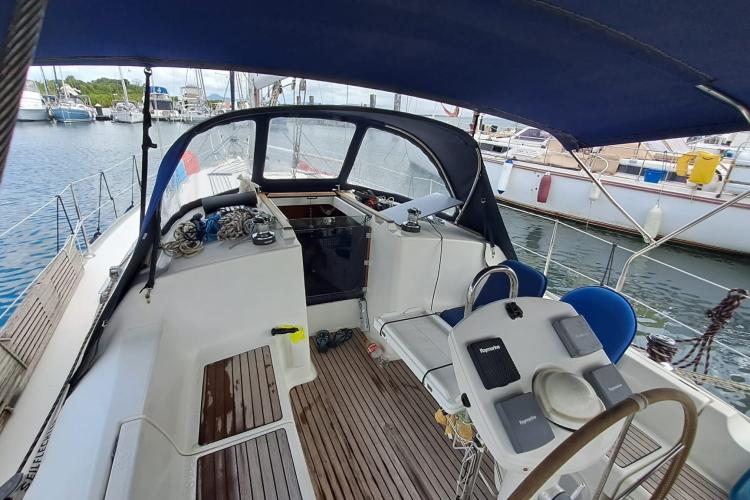 Cockpit of 2000 Jeanneau Sun Odyssey 37 sailboat, docked in a marina.