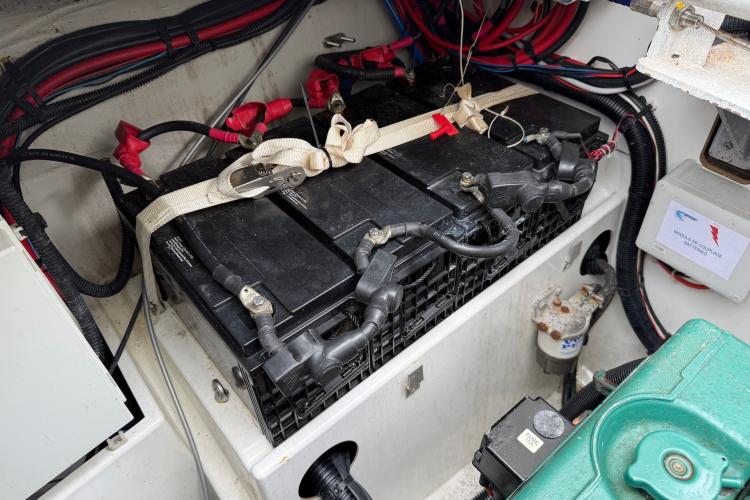 Battery compartment of a 2020 Fountaine Pajot Astrea 42 catamaran, showing wiring and connections.