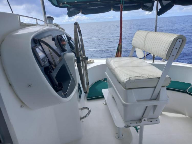 Helm station of 1999 Fountaine Pajot Bahia 46 catamaran with ocean view.