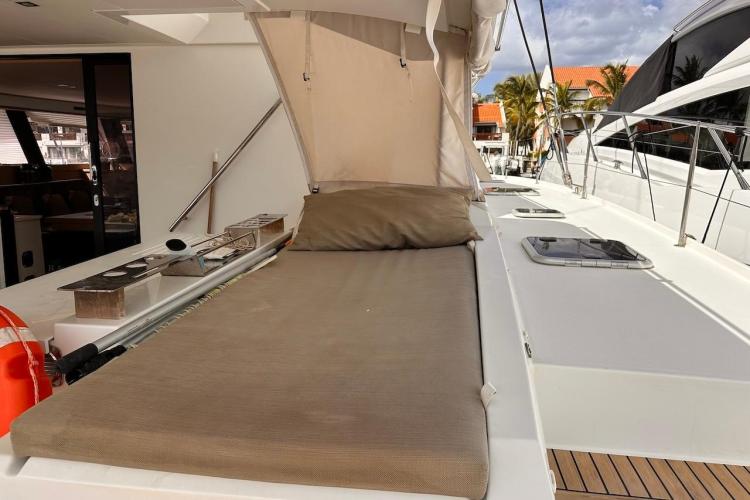 2016 Fountaine Pajot Ipanema 58 yacht deck with sunbed and canopy.