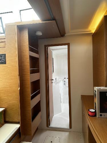 Interior of 2024 Excess 11 yacht, featuring wooden cabinetry and modern design.