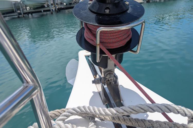 Bow of 2017 Dufour 460 Grand Large sailboat with ropes and winch.