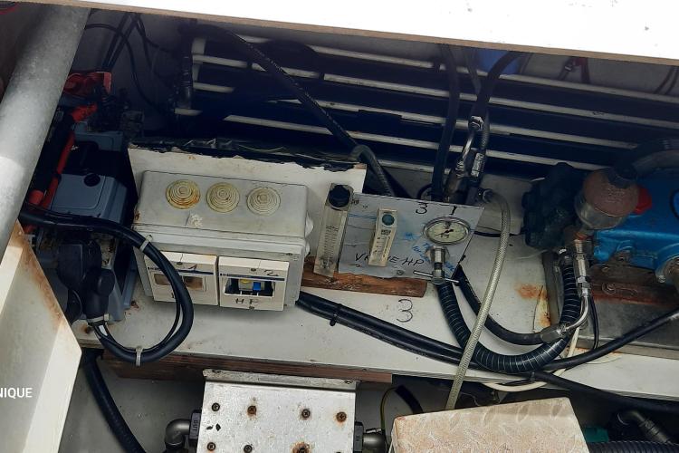 Engine compartment of 2017 Fountaine Pajot SABA 50 catamaran, showing mechanical components and wiring.
