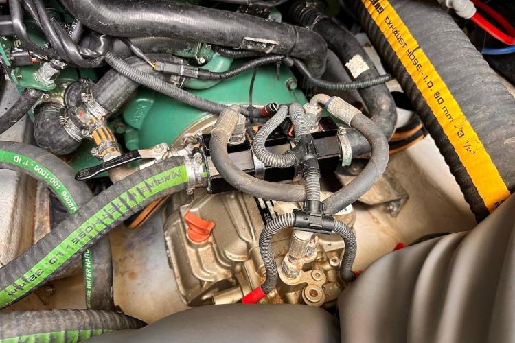 Engine compartment of a 2016 Fountaine Pajot Ipanema 58 catamaran with visible hoses and components.