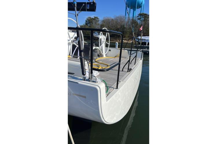 2024 Beneteau First 53 yacht stern view with dual steering wheels.