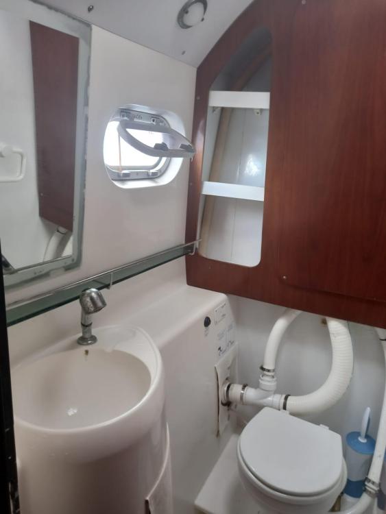 Bathroom interior of 1999 Fountaine Pajot Bahia 46 catamaran with sink and toilet.