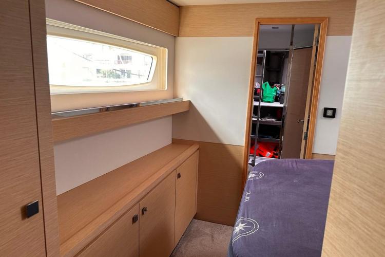 2016 Fountaine Pajot Ipanema 58 cabin interior with modern wood finish and window.