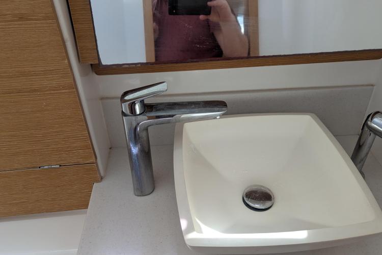 Modern bathroom sink and faucet on 2017 Dufour 460 Grand Large yacht.