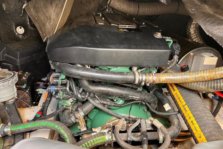 Engine compartment of a 2016 Fountaine Pajot Ipanema 58 catamaran, showcasing hoses and components.