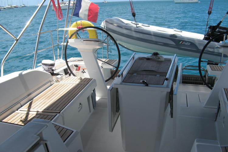 Cockpit of 2019 Beneteau Oceanis 46.1 sailboat with dual steering wheels and tender.