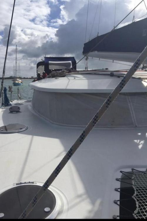 2009 Fountaine Pajot Orana 44 catamaran on water under cloudy sky.
