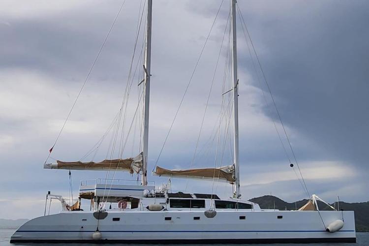 Sailing catamaran Etoile Marine NAUTILUS 360, 2004, anchored under cloudy skies.