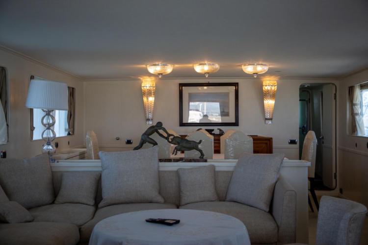 Luxurious interior of 1972 Benetti 33 yacht with elegant decor and comfortable seating.