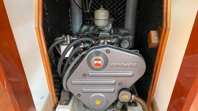 Yanmar engine in a 2005 Beneteau Cyclades 43.3 sailboat, showcasing detailed components.