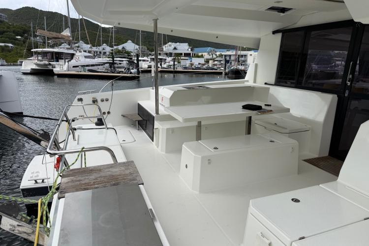 Spacious deck of 2020 Fountaine Pajot Astrea 42 catamaran docked at marina.
