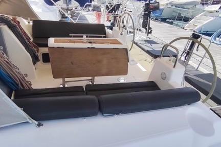 2017 Dufour 460 Grand Large yacht cockpit with dual steering wheels and seating.