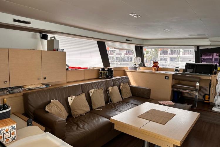 Luxurious interior of 2016 Fountaine Pajot Ipanema 58 catamaran with modern furnishings.