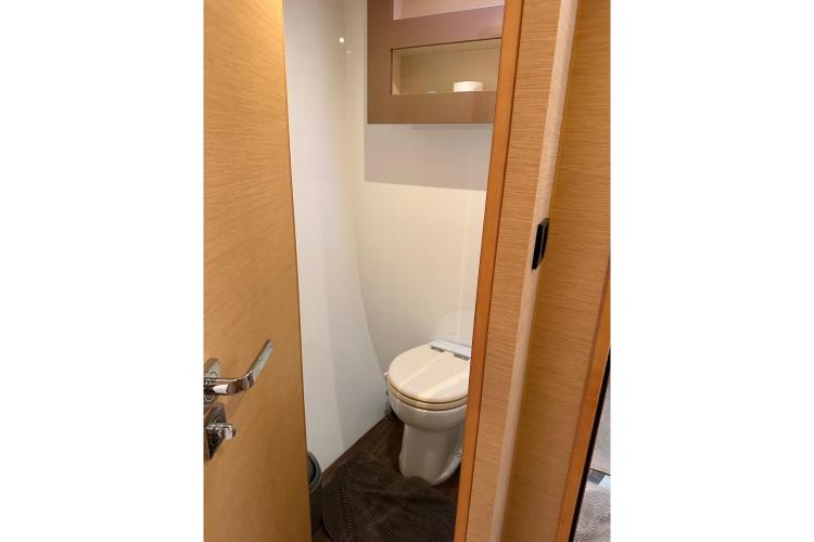2016 Fountaine Pajot Ipanema 58 yacht bathroom with modern design and wooden accents.