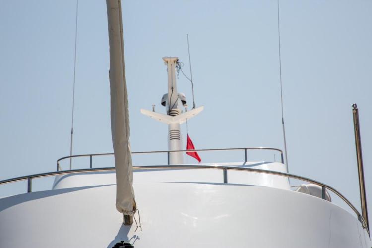 1972 Benetti 33 yacht, close-up of upper deck and mast against clear sky.