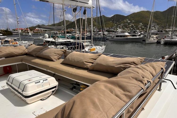 Luxurious 2016 Fountaine Pajot Ipanema 58 yacht with spacious deck and scenic marina view.