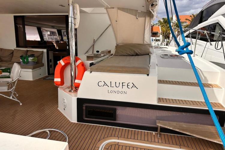 2016 Fountaine Pajot Ipanema 58 yacht deck with seating and life preserver.