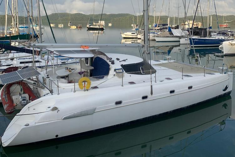 2006 Fountaine Pajot Bahia 46 catamaran docked in a marina with other boats.