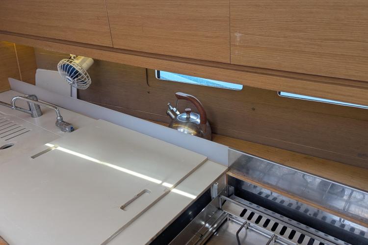 Modern kitchen interior of 2017 Dufour 460 Grand Large yacht with sink and kettle.