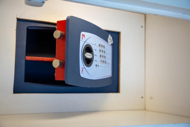 Open electronic safe inside a Benetti 33 yacht, model year 1972.
