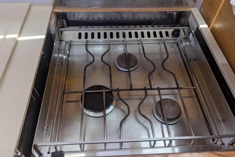 Stainless steel stove with three burners on a 2017 Dufour 460 Grand Large yacht.