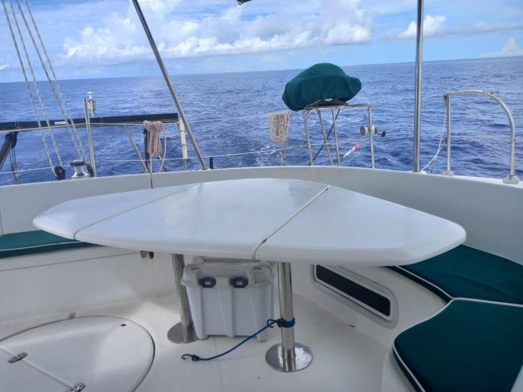 Cockpit of 1999 Fountaine Pajot Bahia 46 catamaran with ocean view and seating area.