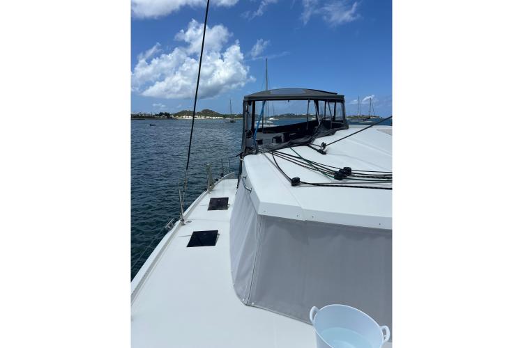 2023 Fountaine Pajot Astrea 42 Catamaran on calm waters under blue sky.