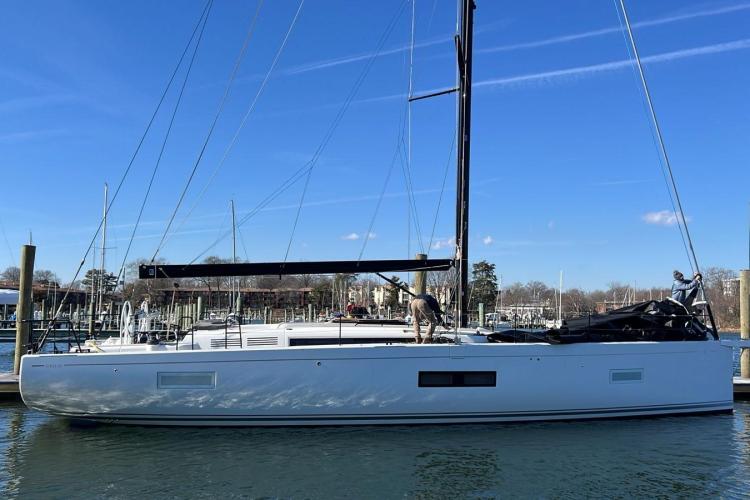 2024 Beneteau First 53 sailboat docked in a marina under clear blue skies.