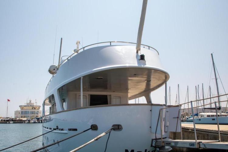 1972 Benetti 33 yacht docked at a marina, showcasing sleek design and elegant structure.