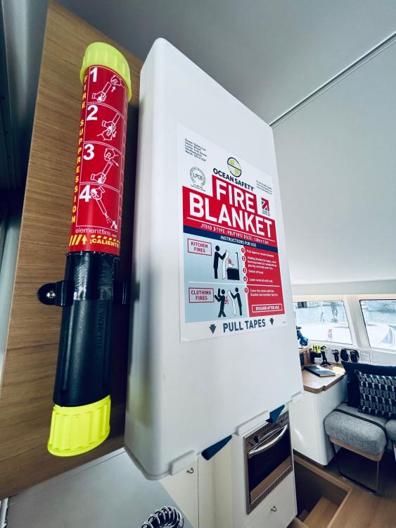 Fire safety equipment on 2024 Excess 14 boat, featuring fire blanket and extinguisher.