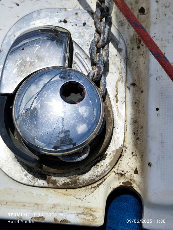 Close-up of a 2005 Beneteau Cyclades 43.3 yacht's anchor windlass with chain.