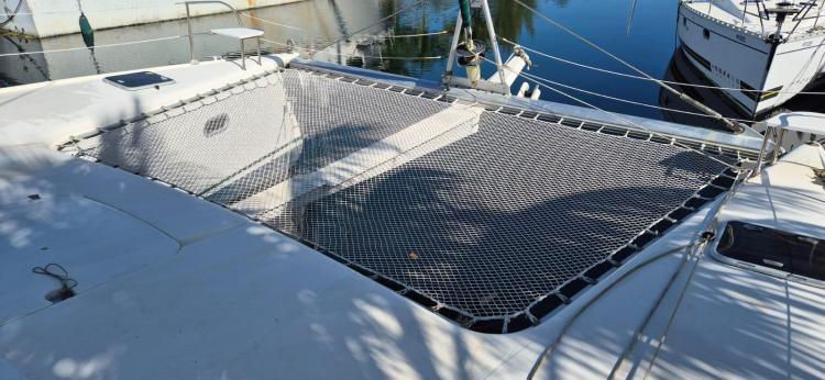 Catamaran netting on 1999 Fountaine Pajot Bahia 46, docked in a marina.