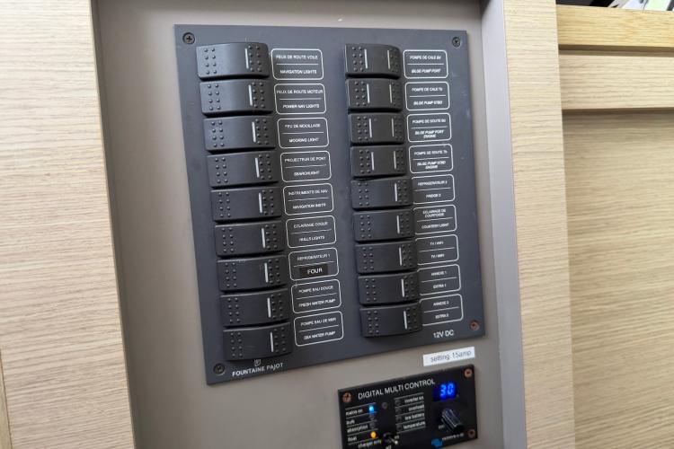 Control panel of a 2020 Fountaine Pajot Astrea 42 yacht, featuring labeled switches.