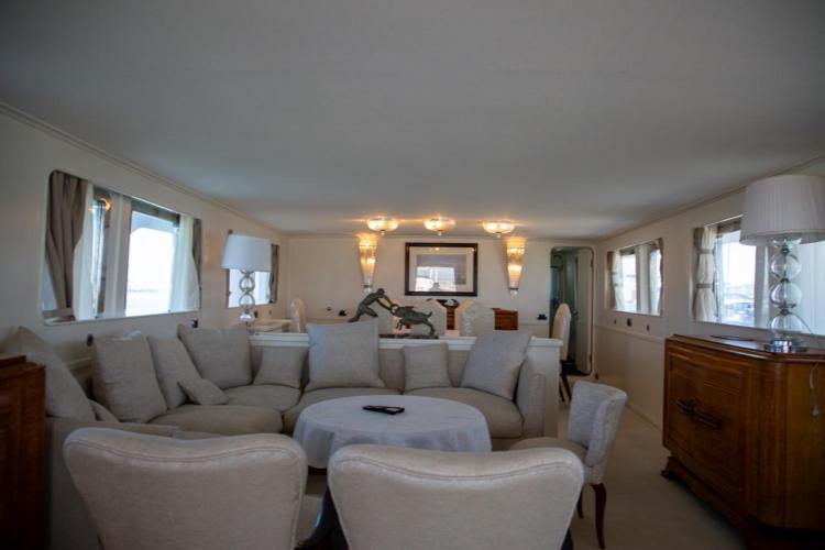 Luxurious interior of 1972 Benetti 33 yacht with elegant seating and decor.