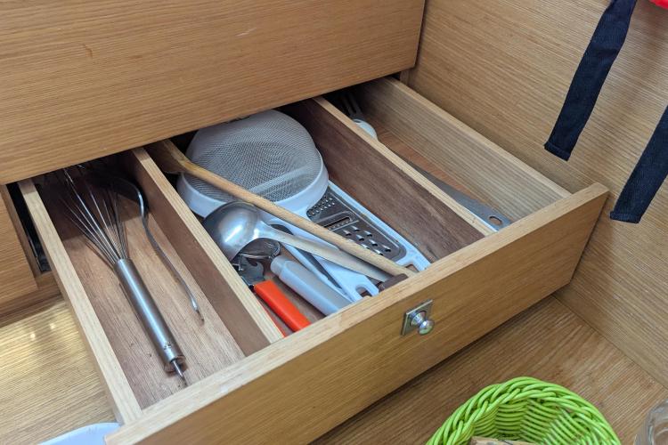 Kitchen drawer with utensils on a 2017 Dufour 460 Grand Large yacht.