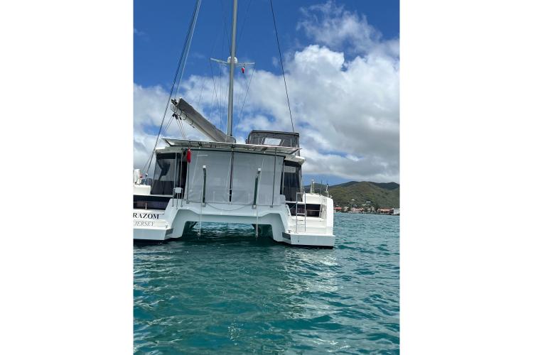 2023 Fountaine Pajot Astrea 42 Catamaran sailing on clear blue waters.