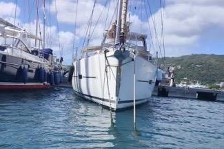 Dufour 460 Grand Large 2017 docked, surrounded by water and boats.