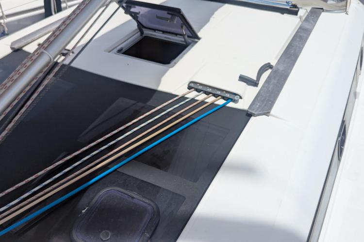 Deck of 2017 Dufour 460 Grand Large sailboat with open hatch and rigging lines.