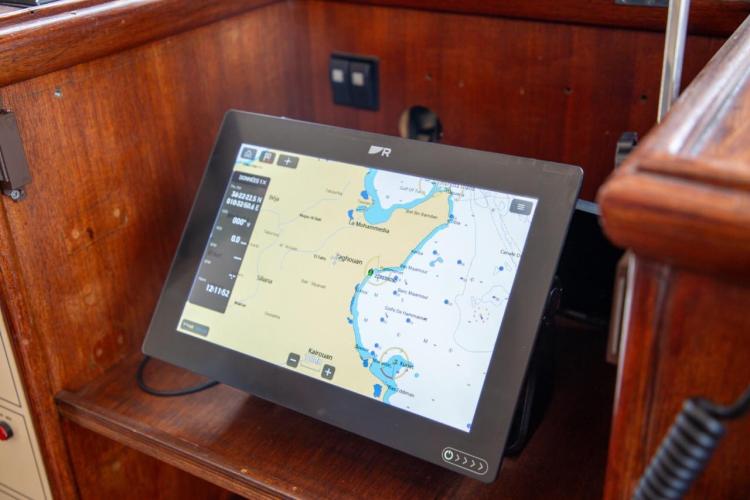 Navigation screen on a 1972 Benetti 33 yacht, displaying a detailed maritime map.
