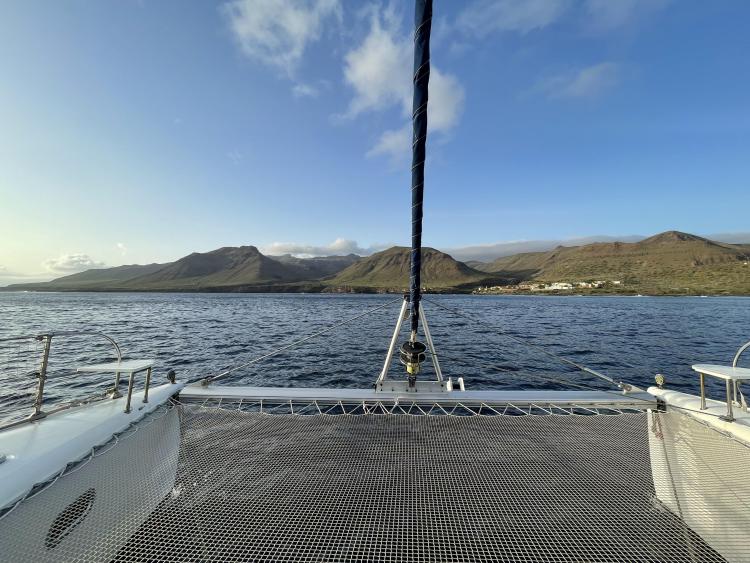 Catamaran Fountaine Pajot Bahia 46 sailing with mountain view, 2006 model.