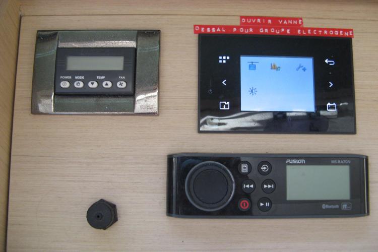 Control panel on a 2019 Beneteau Oceanis 46.1 yacht, featuring various electronic displays.