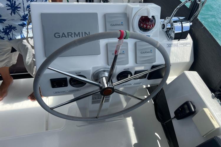 Helm of 2023 Fountaine Pajot Astrea 42 Catamaran with Garmin navigation system.