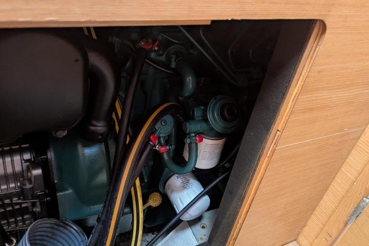 Engine compartment of a 2017 Dufour 460 Grand Large sailboat, showcasing mechanical components.