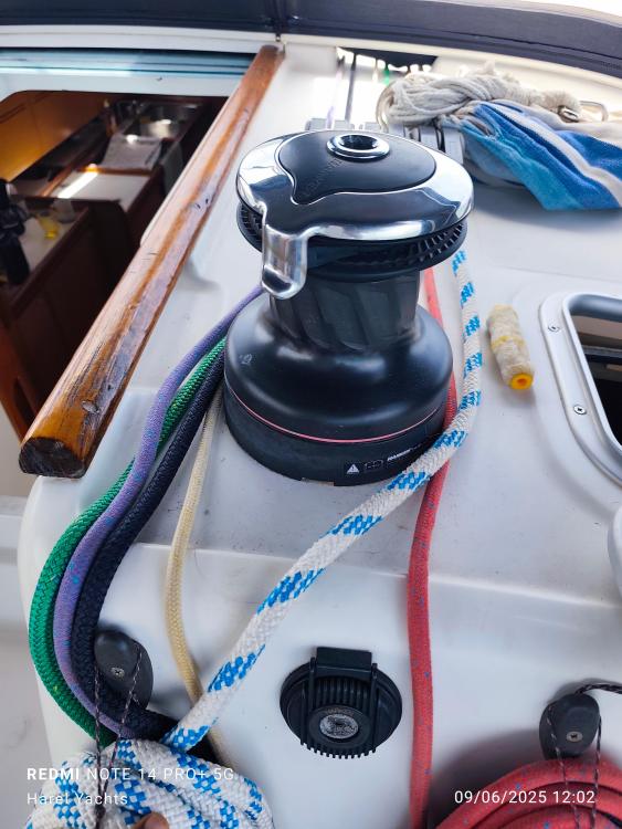 Winch and ropes on 2005 Beneteau Cyclades 43.3 sailboat deck.