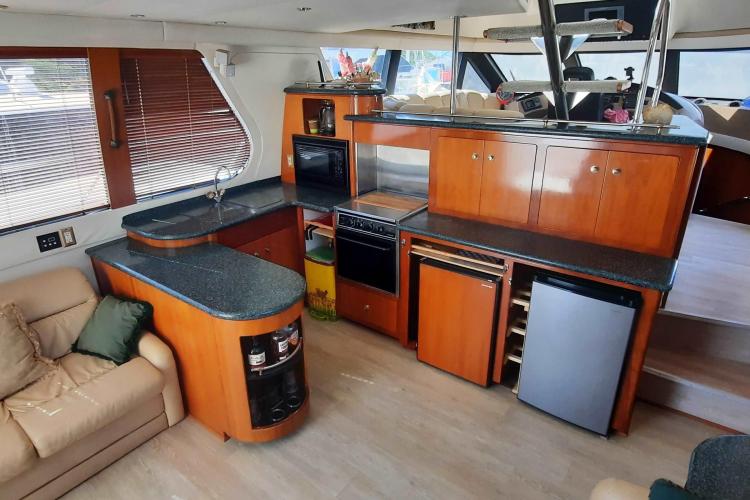 Interior of 2000 Carver 530 Voyager Pilothouse with modern kitchen and seating area.